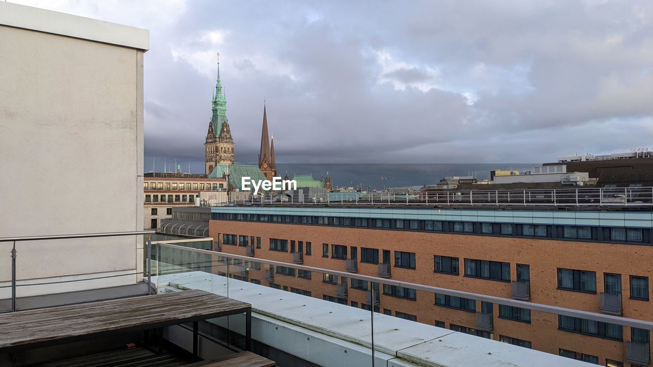 Buildings in city against sky