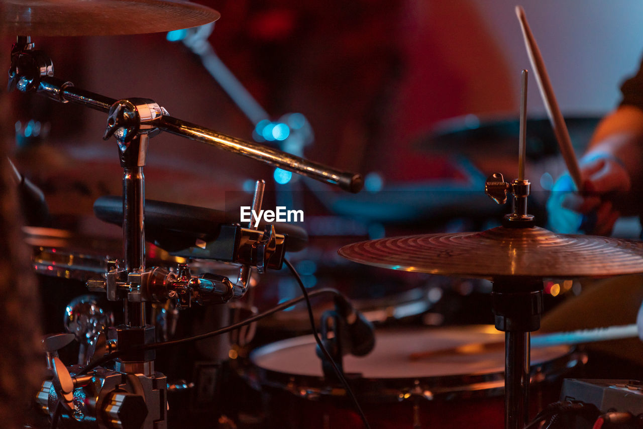 Close-up of drum and cymbal on stage