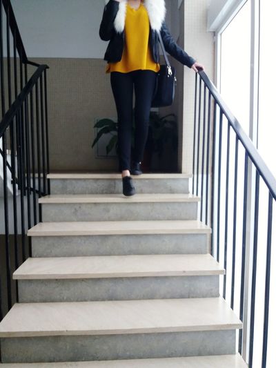 Low section of person walking on stairs
