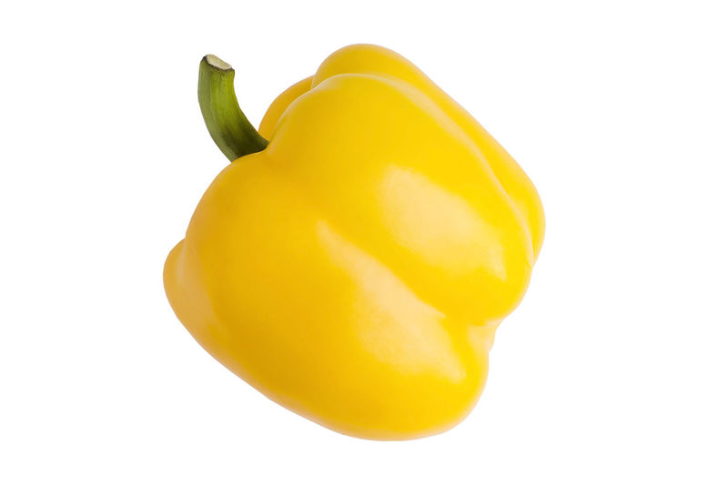 Close-up of yellow bell pepper against white background