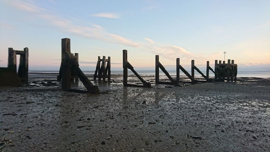 Scenic view of beach against sky during sunset