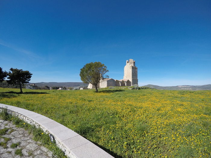 Scenic view of castle against blue sky