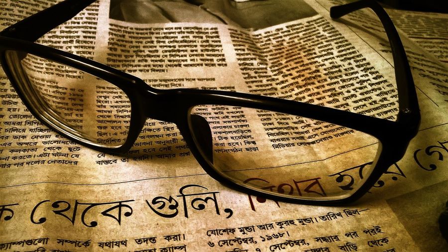 Close-up of eyeglasses on book