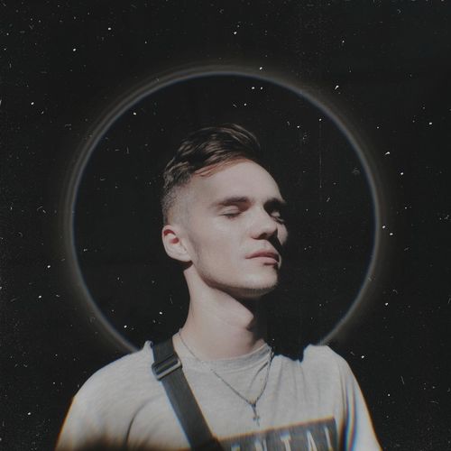 Digital composite image of young man against star field