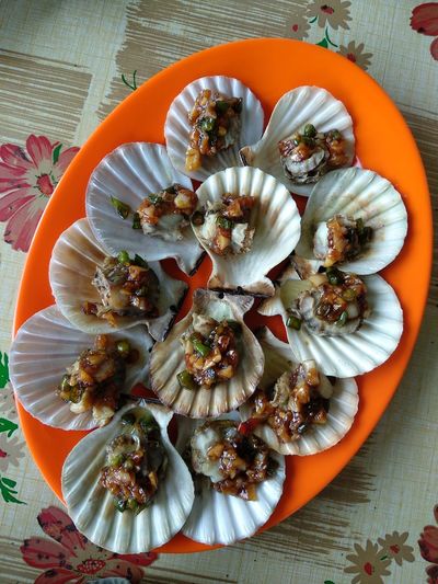 High angle view of shells in plate on table
