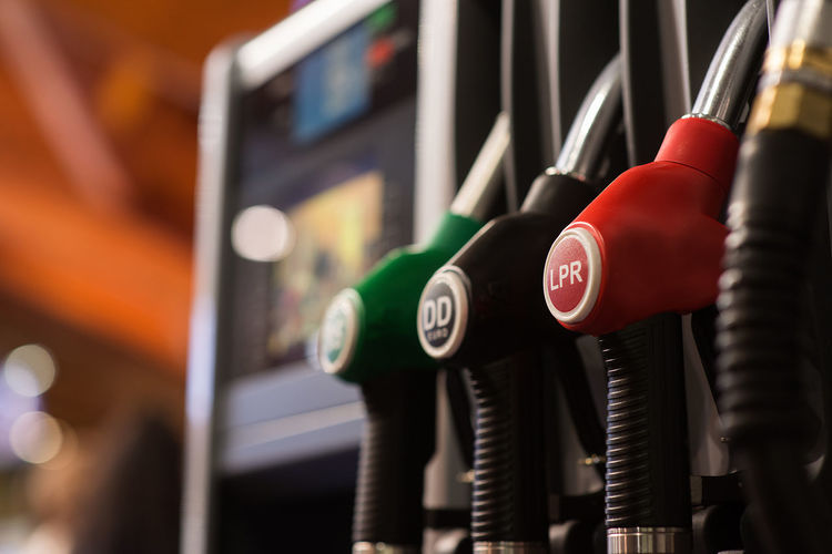 Close-up of multi colored fuel pumps at gas station