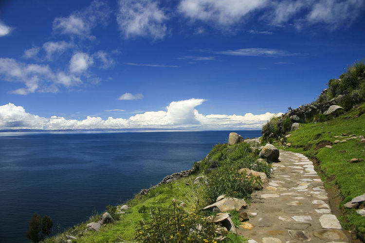 Idyllic shot of lake titicaca against sky