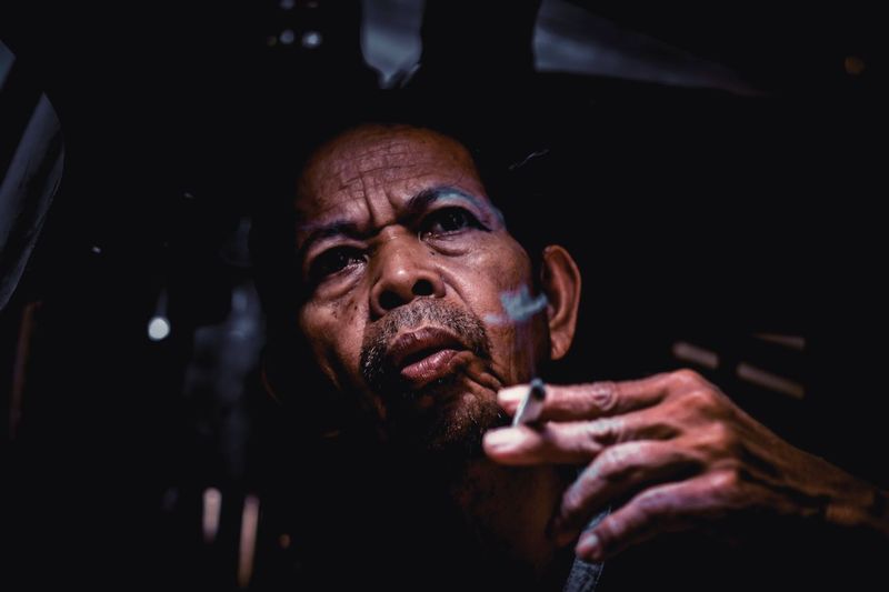 Portrait of man looking at camera