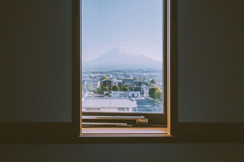 CITY SEEN THROUGH WINDOW