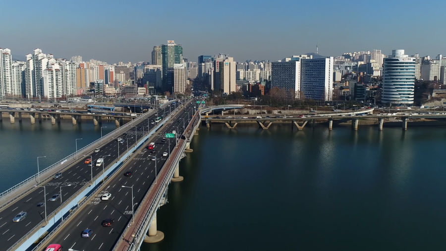Panoramic view of river and buildings against sky