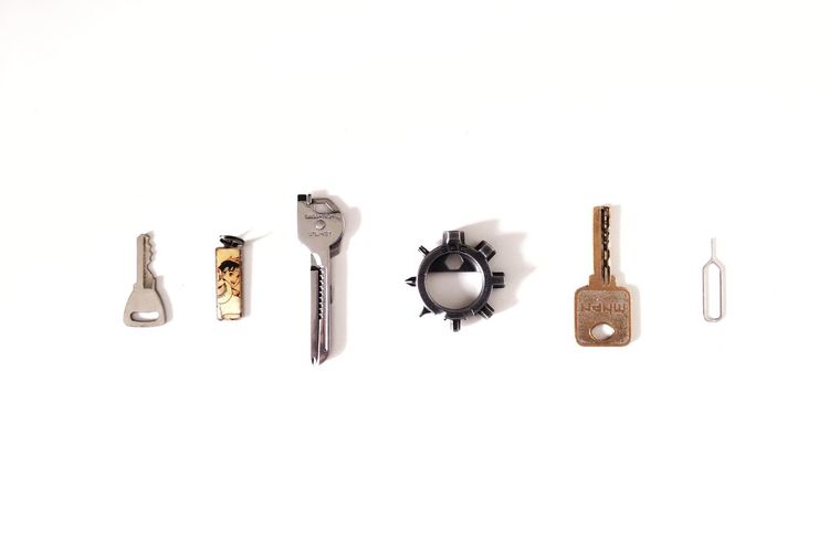 Directly above shot of various objects over white background