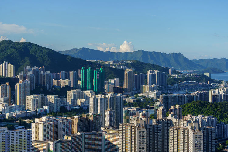 High angle view of buildings in city against sky