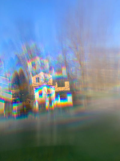 Defocused image of light trails against sky