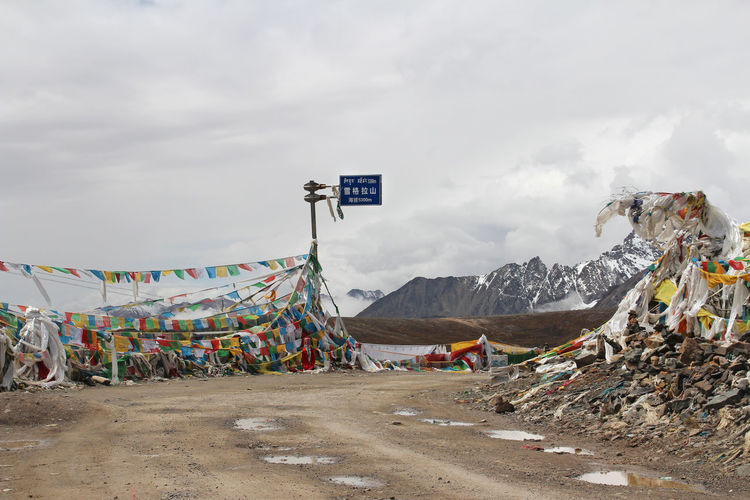 View of mountains with the prayer flags at xuegela mountain pass in tibet, china