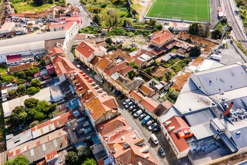 Aerial view of a small residential district in lisbon outskirt along a railway,, lisbon, portugal.