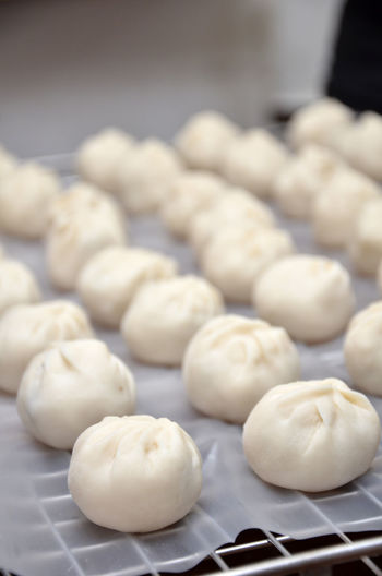 Close-up of chinese dumplings on wax paper