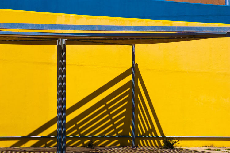 Close-up of yellow metal railing