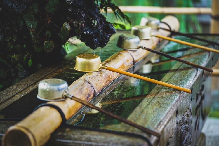 Close up of ladles on bamboo