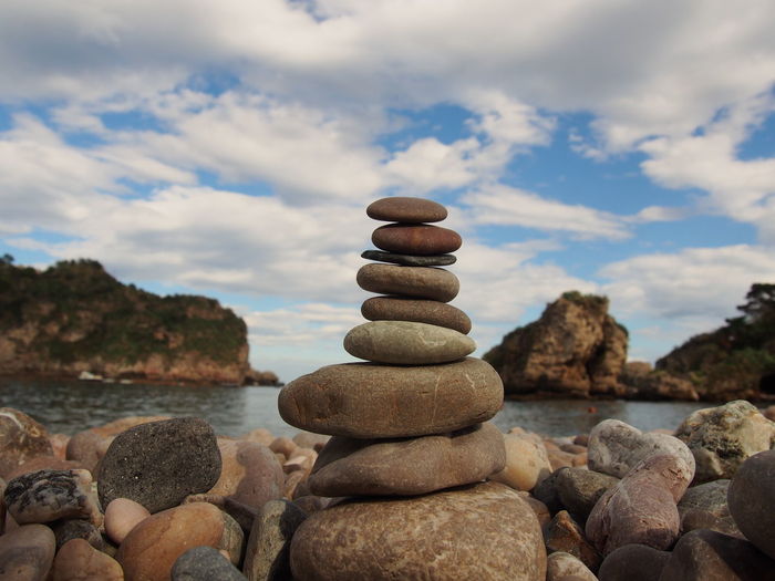 Close-up of stack of stones on the beach