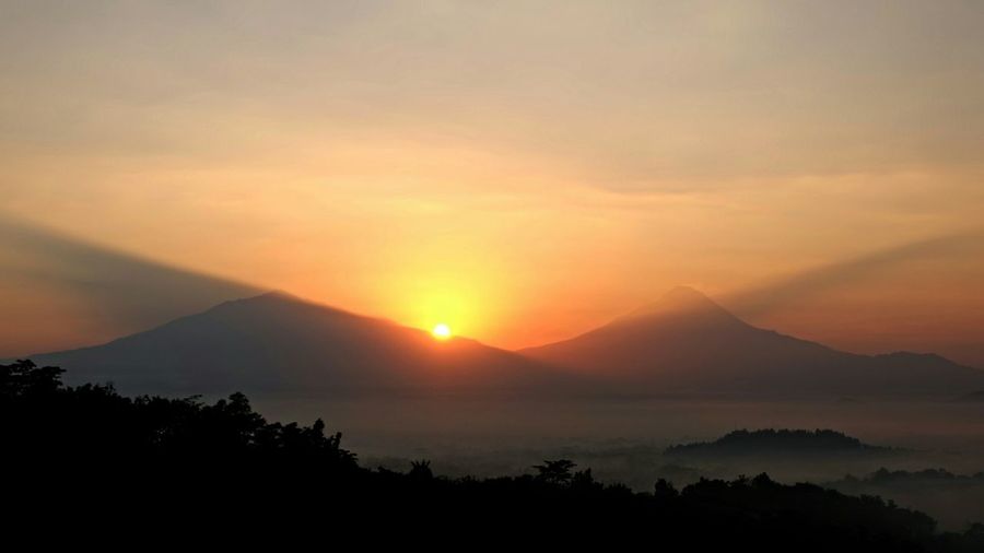 Scenic view of mountains at sunset