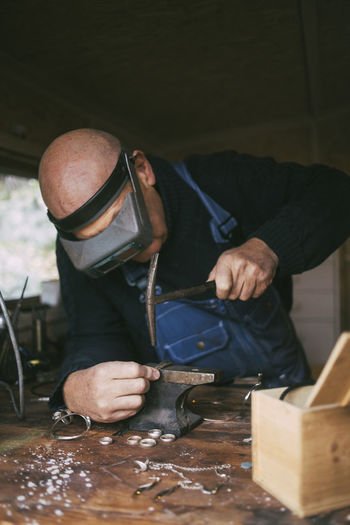 Male welder working in workshop