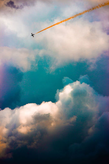Low angle view of vapor trails in sky
