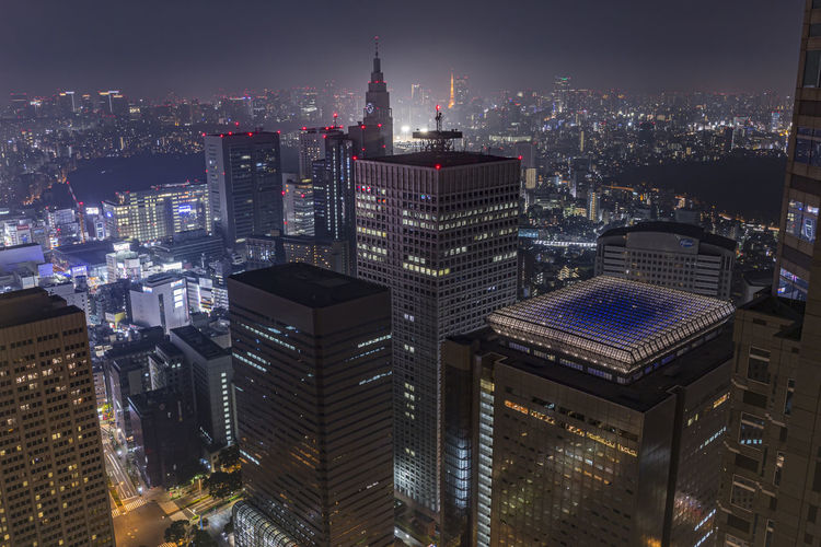 High angle view of illuminated buildings in tokyo city at night