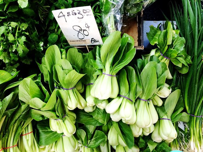 High angle view of bok choy bundles for sale in market