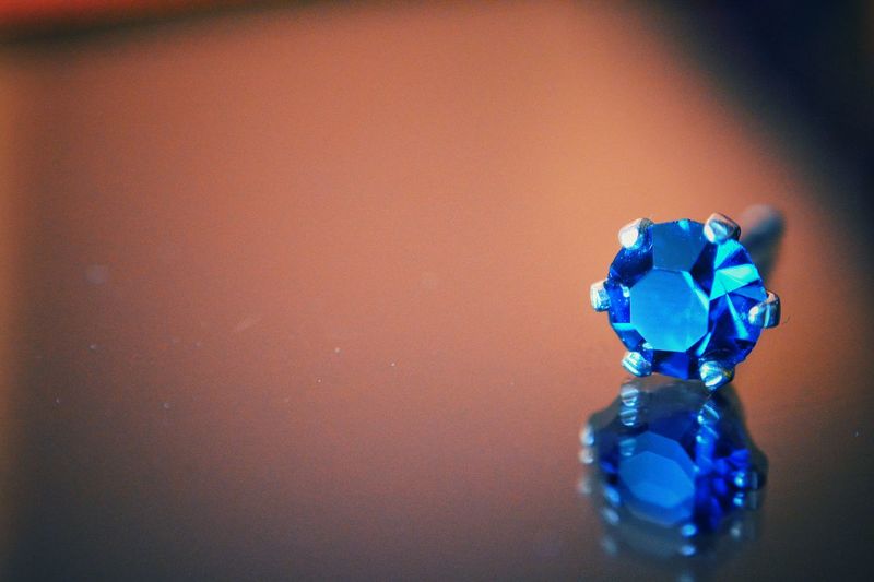Close-up of diamond on table