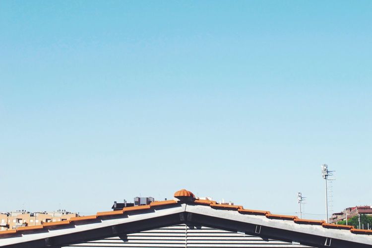 Low angle view of built structure against clear blue sky