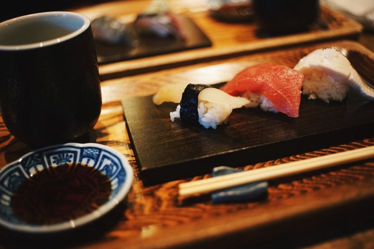 Close-up of sushi and drink on table