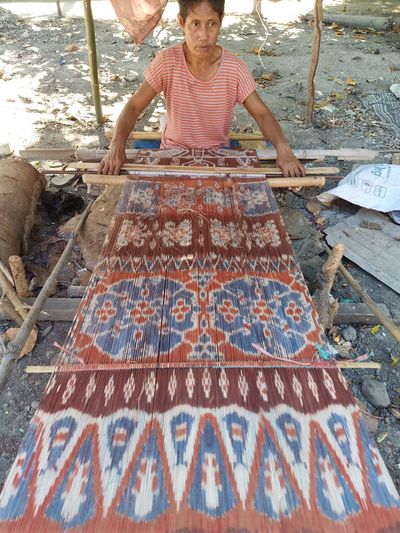 Full length of woman working
