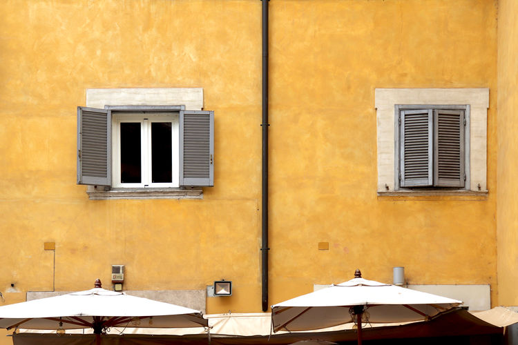 Close up of a bright yellow building in italy