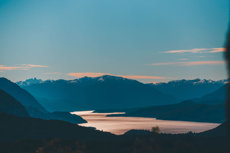 Scenic view of silhouette mountains against sky during sunset