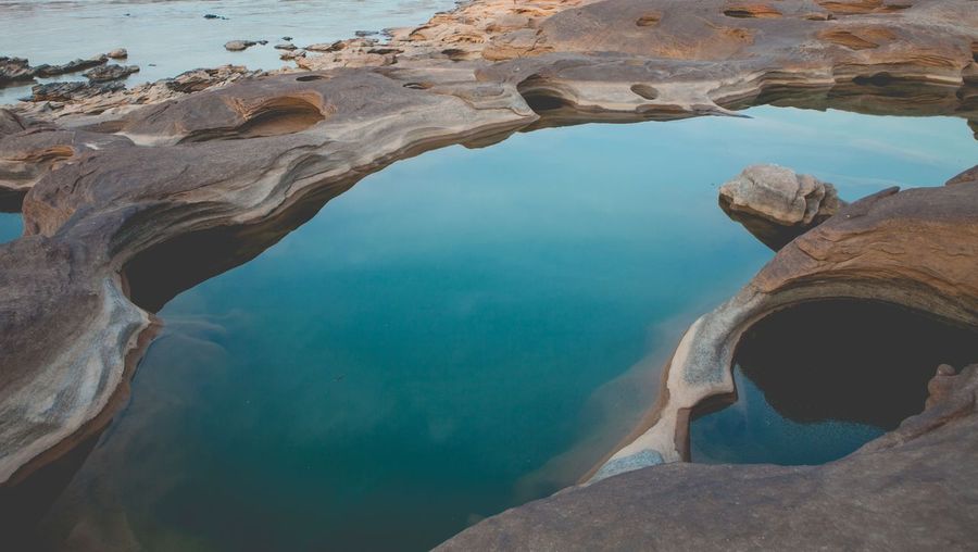 High angle view of tidal pool on rock formation