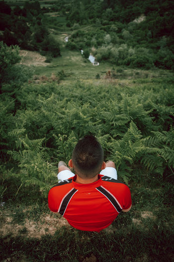 Rear view of boy on field