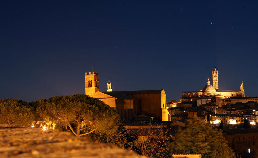 View of illuminated buildings at night