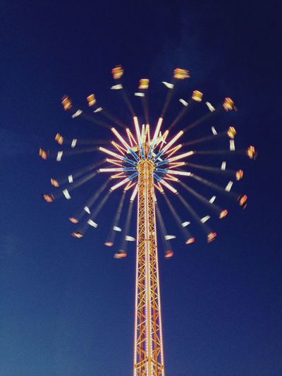 Ferris wheel against sky at night