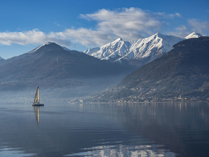 Single sail boat on lake como