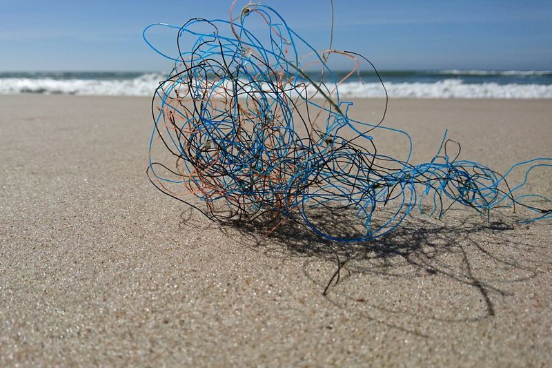 Close-up of wires on sand