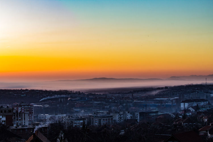 High angle view of townscape against sky during sunrise