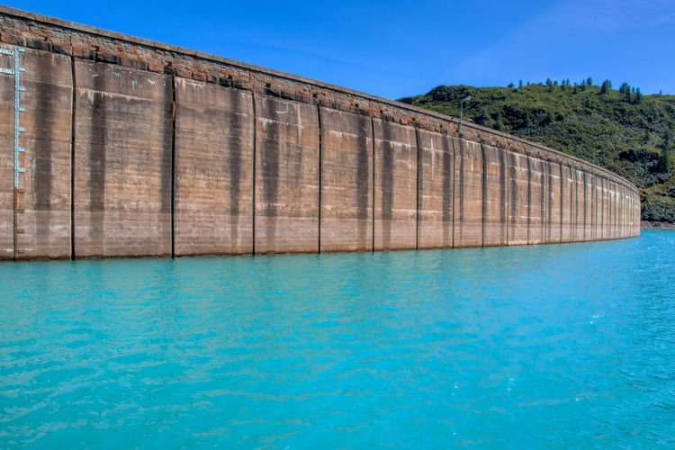 High angle view of dam swimming pool against blue sky