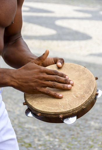 Instrumentalist playing tambourine in the streets of pelourinho in salvador in bahia, brazil