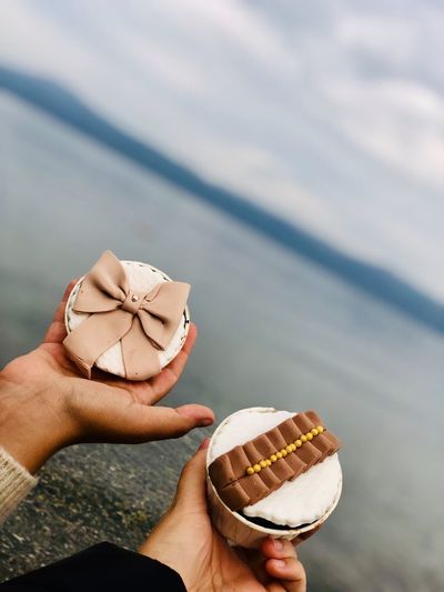 Midsection of person holding ice cream
