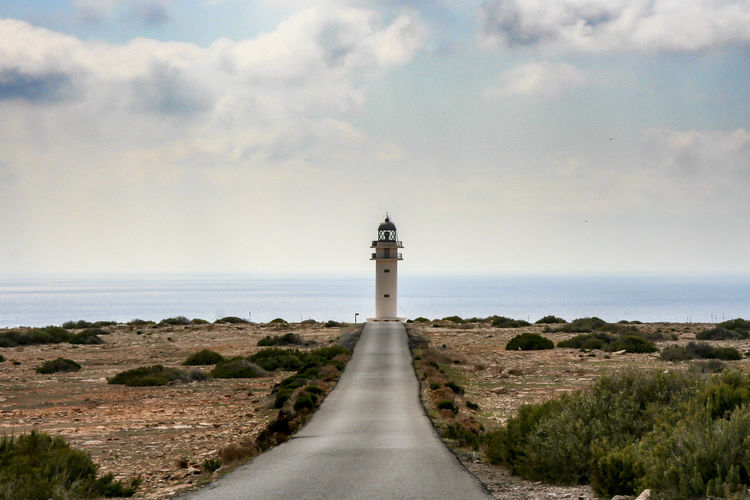 Scenic view of footpath leading to lighthouse