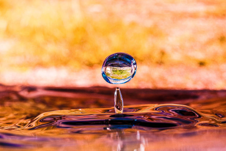 Close-up of water splashing on glass