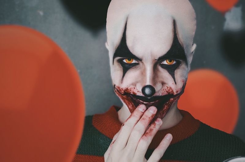 Close-up portrait of man dressed as clown