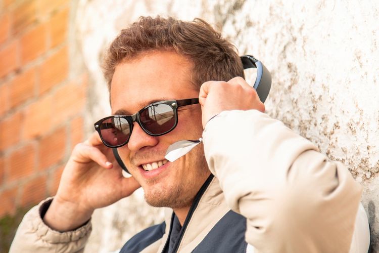 Young man with wireless headphones