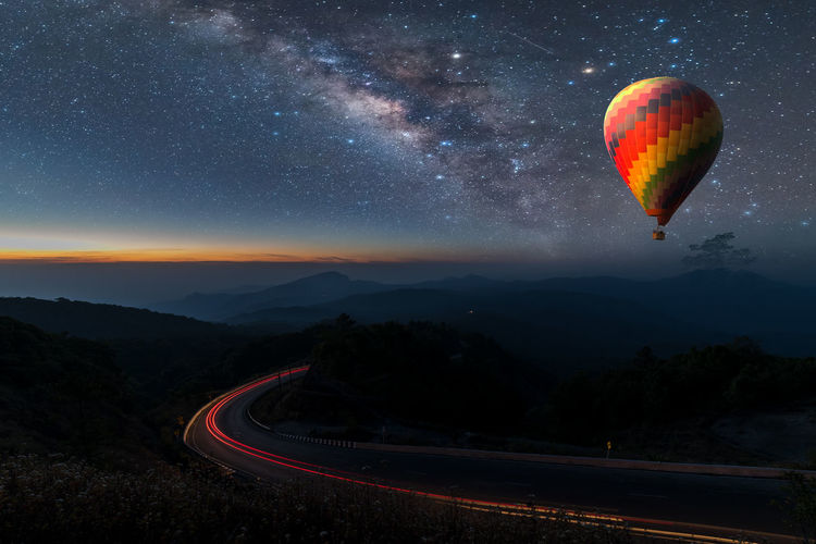 Aerial view of hot air balloon against sky at night
