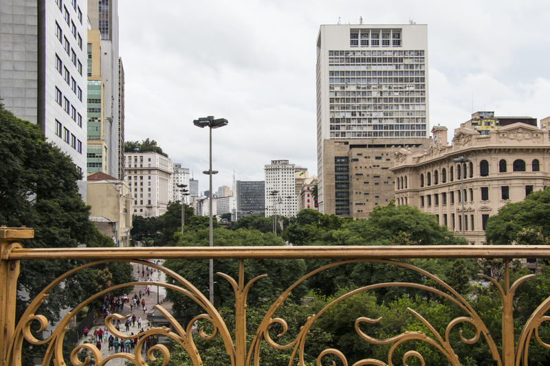 Modern buildings in city against sky